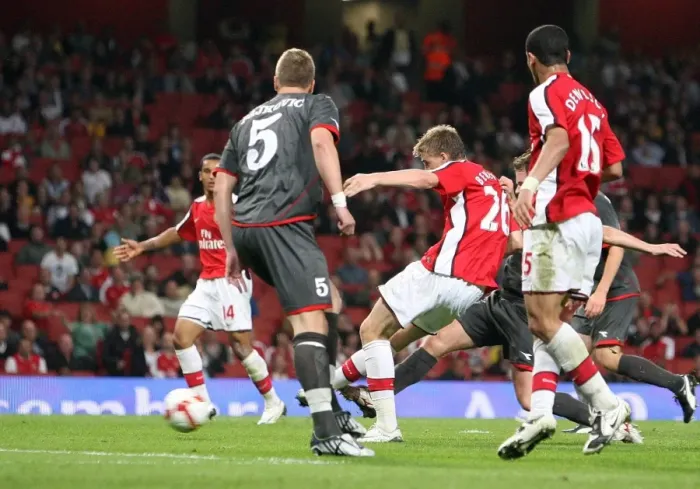 Framed Print : Bendtner's Brilliant Goal: Arsenal Crushes FC Twente 4-0 in Champions League