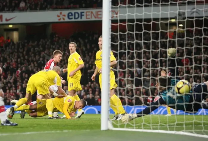 Framed Print : Bendtner's Brilliant Header: Arsenal's 4-0 FA Cup Victory over Cardiff