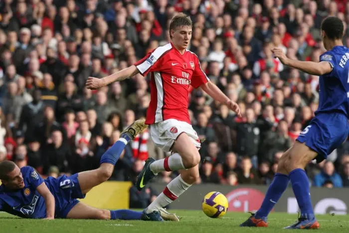 Framed Print : Bendtner's Victory: Arsenal's 2-1 Triumph Over Manchester United's Vidic and Ferdinand (2008) Framed Print : Bendtner's Victory: Arsenal's 2-1 Triumph Over Manchester United's Vidic and Ferdinand (2008)
