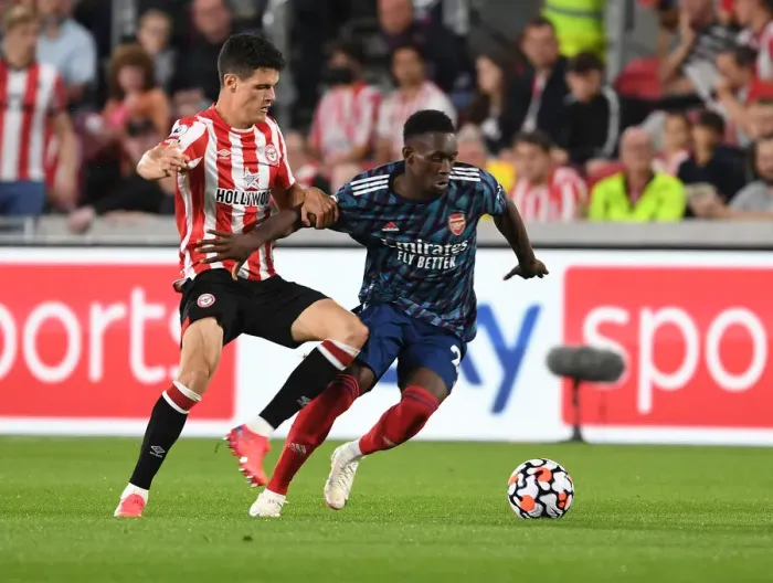 Framed Print : Brentford vs Arsenal: Intense Clash between Flo Balogun and Christian Norgaard in the 2021-22 Premier League