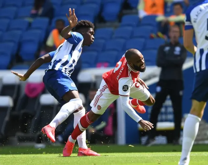 Framed Print : Brighton vs. Arsenal: Empty Stadium Clash - Lacazette Fouls Bissouma Framed Print : Brighton vs. Arsenal: Empty Stadium Clash - Lacazette Fouls Bissouma