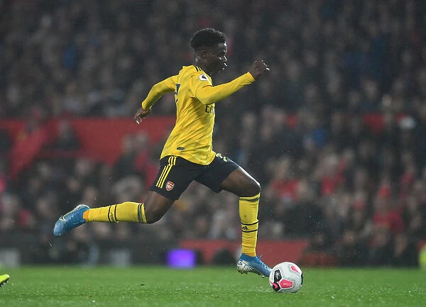 Bukayo Saka in Action: A Fighting Performance for Arsenal Against Manchester United at Old Trafford, Premier League 2019-20