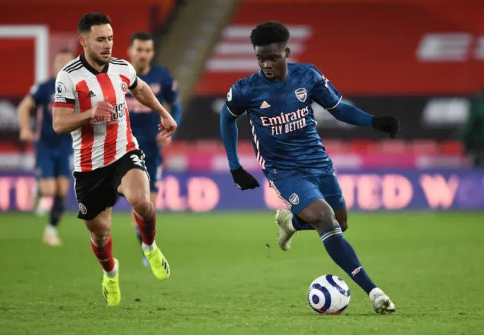 Framed Print : Bukayo Saka Breaks Past Sheffield United's George Baldock: Arsenal vs Sheffield United, Premier League 2021