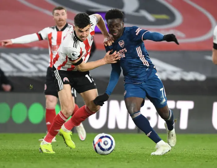 Framed Print : Bukayo Saka Breaks Past Sheffield United's John Egan in Empty Bramall Lane - Arsenal vs Sheffield United, Premier League 2020-21