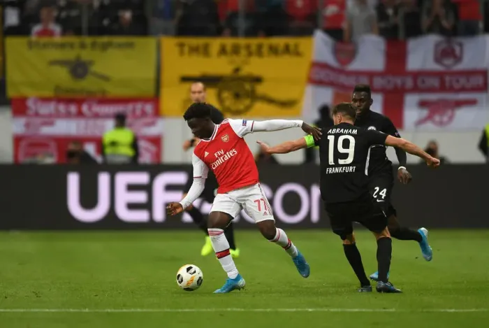 Framed Print : Bukayo Saka Clashes with David Abraham: Eintracht Frankfurt vs. Arsenal, UEFA Europa League 2019-20 Framed Print : Bukayo Saka Clashes with David Abraham: Eintracht Frankfurt vs. Arsenal, UEFA Europa League 2019-20