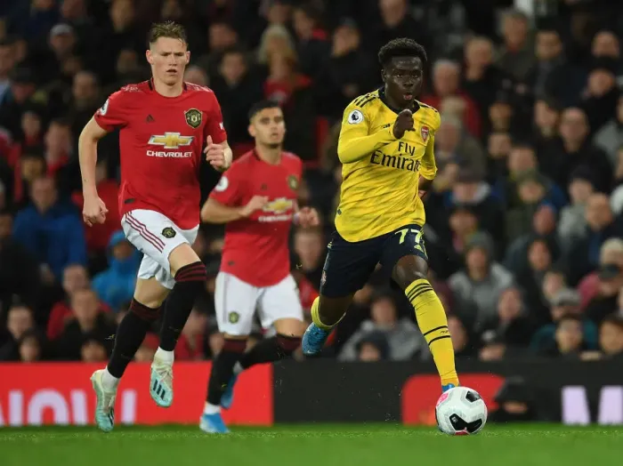 Framed Print : Bukayo Saka Darts Past Scott McTominay: Manchester United vs. Arsenal, Premier League 2019-20 Framed Print : Bukayo Saka Darts Past Scott McTominay: Manchester United vs. Arsenal, Premier League 2019-20
