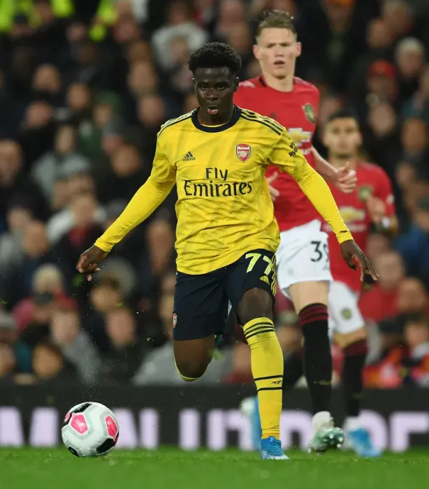 Framed Print : Bukayo Saka Dashes Past McTominay: Manchester United vs. Arsenal, Premier League 2019-20