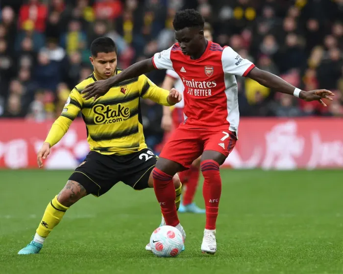 Framed Print : Bukayo Saka Faces Off Against Cucho Hernandez: Watford vs Arsenal, Premier League 2021-22