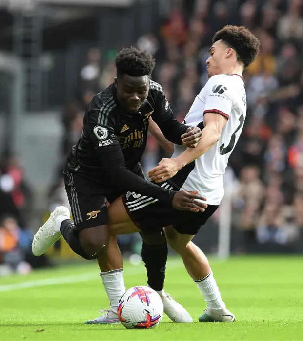 Framed Print : Bukayo Saka Fouled by Antonee Robinson in Fulham vs Arsenal Premier League Clash (2022-23)