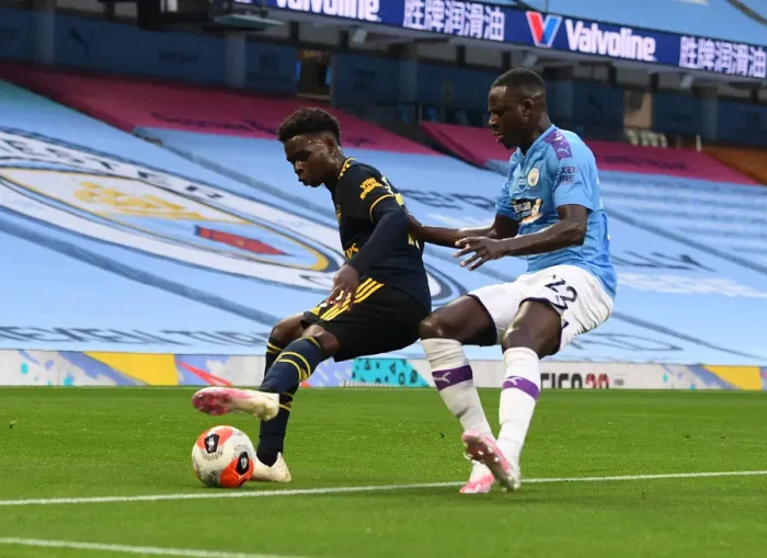 Framed Print : Bukayo Saka Stands Firm Against Benjamin Mendy: Manchester City vs. Arsenal, Premier League 2019-20 Framed Print : Bukayo Saka Stands Firm Against Benjamin Mendy: Manchester City vs. Arsenal, Premier League 2019-20