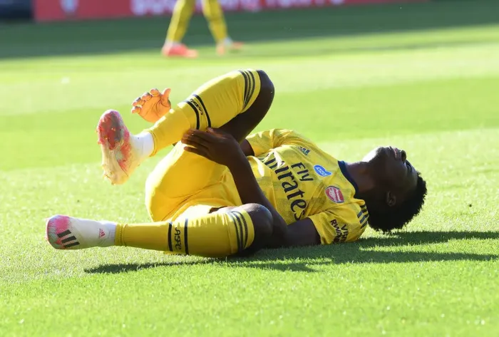 Framed Print : Bukayo Saka Suffers Injury in Southampton vs. Arsenal Clash (2019-20)