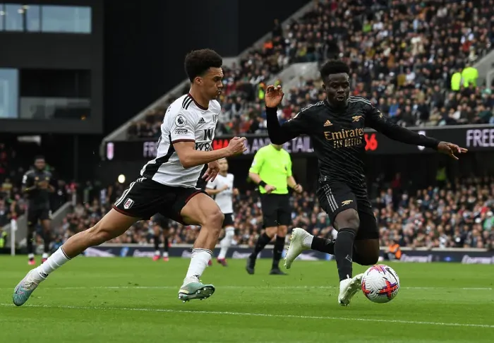 Framed Print : Bukayo Saka vs Antonee Robinson: Intense Battle at Craven Cottage - Fulham vs Arsenal, Premier League 2022-23 Framed Print : Bukayo Saka vs Antonee Robinson: Intense Battle at Craven Cottage - Fulham vs Arsenal, Premier League 2022-23