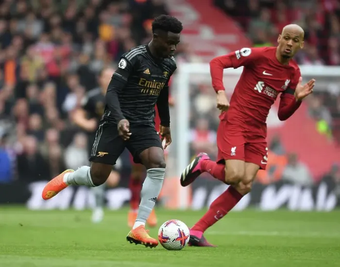 Framed Print : Bukayo Saka vs Fabinho: Intense Battle at Anfield - Liverpool vs Arsenal, Premier League 2022-23