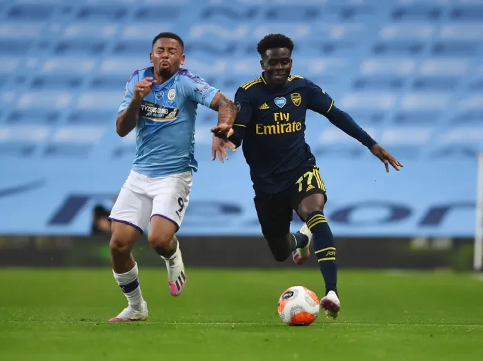 Framed Print : Bukayo Saka vs. Gabriel Jesus: Clash of Premier League Titans - Manchester City vs. Arsenal FC Framed Print : Bukayo Saka vs. Gabriel Jesus: Clash of Premier League Titans - Manchester City vs. Arsenal FC