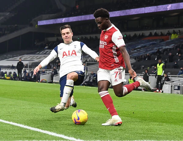 Bukayo Saka vs. Giovanni Lo Celso: Battle at the Tottenham Hotspur Stadium - Arsenal vs. Tottenham Premier League Clash (December 2020)