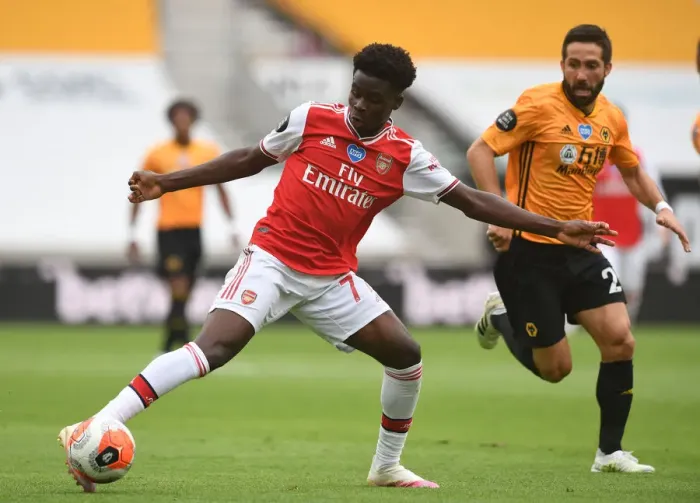 Framed Print : Bukayo Saka vs Joao Moutinho: Intense Battle at Molineux - Wolverhampton Wanderers vs Arsenal FC, Premier League 2019-2020 Framed Print : Bukayo Saka vs Joao Moutinho: Intense Battle at Molineux - Wolverhampton Wanderers vs Arsenal FC, Premier League 2019-2020