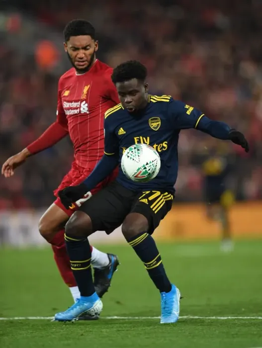 Framed Print : Bukayo Saka vs Joe Gomez: A Footballing Battle at Anfield - Carabao Cup Showdown Framed Print : Bukayo Saka vs Joe Gomez: A Footballing Battle at Anfield - Carabao Cup Showdown