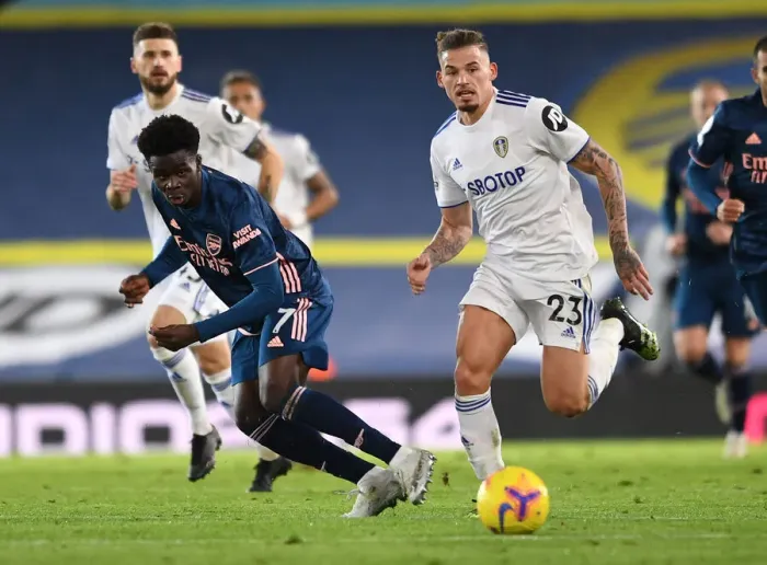 Framed Print : Bukayo Saka vs. Kalvin Phillips: Intense Battle at Elland Road - Leeds United vs. Arsenal, Premier League 2020-21