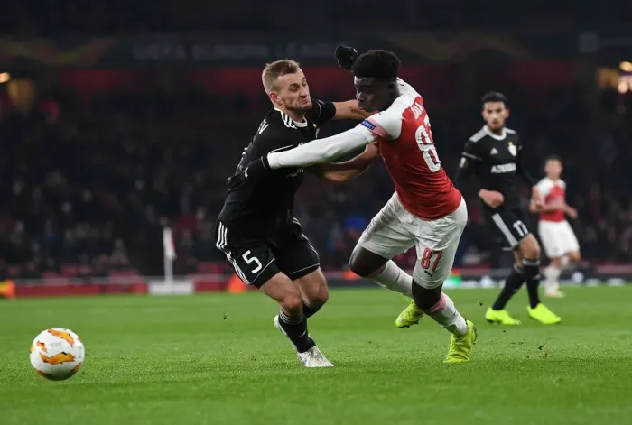 Framed Print : Bukayo Saka vs Maksin Medvedev: Arsenal vs Qarabag UEFA Europa League Clash Framed Print : Bukayo Saka vs Maksin Medvedev: Arsenal vs Qarabag UEFA Europa League Clash