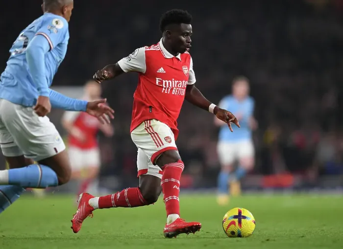 Framed Print : Bukayo Saka vs Manchester City: Arsenal's Rising Star Clashes with Premier League Titans