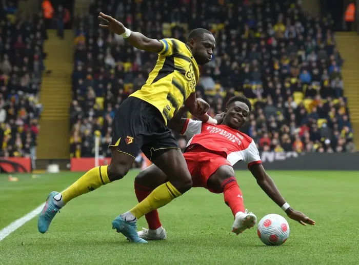Framed Print : Bukayo Saka vs. Moussa Sissoko: Intense Clash in Watford v Arsenal Premier League Match