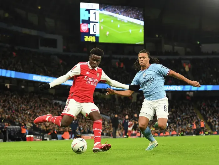 Framed Print : Bukayo Saka vs. Nathan Ake: Clash of the Stars in Manchester City vs. Arsenal FA Cup Match, 2023