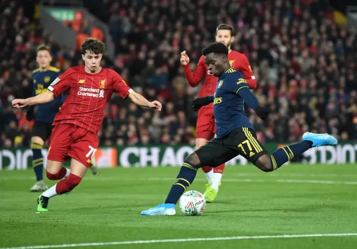 Framed Print : Bukayo Saka vs. Neco Williams: Intense Battle at Anfield - Carabao Cup 2019-20: Liverpool vs. Arsenal Framed Print : Bukayo Saka vs. Neco Williams: Intense Battle at Anfield - Carabao Cup 2019-20: Liverpool vs. Arsenal