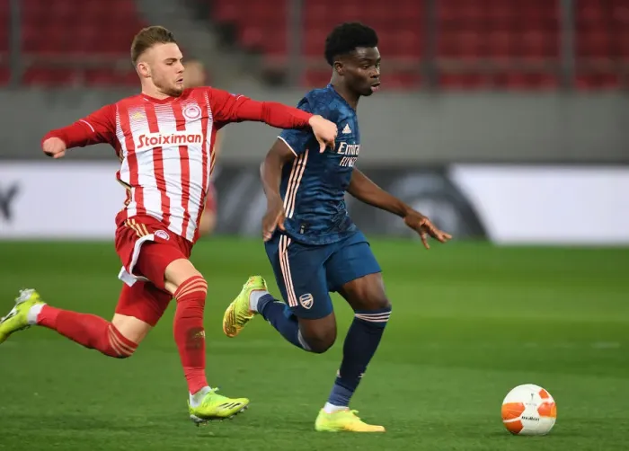 Framed Print : Bukayo Saka vs. Oleg Reabciuk: A Battle in Empty Karaiskakis Stadium - Arsenal's Europa League Clash with Olympiacos