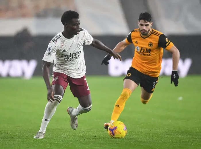 Framed Print : Bukayo Saka vs Pedro Neto: Battle at Molineux - Wolverhampton Wanderers vs Arsenal, Premier League 2020-21