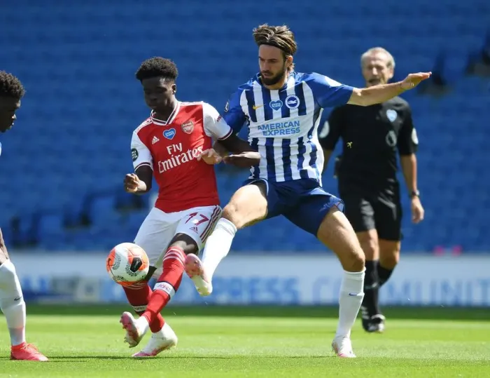 Framed Print : Bukayo Saka vs. Propper: Empty Stadium Showdown - Brighton vs. Arsenal Amidst the Pandemic Framed Print : Bukayo Saka vs. Propper: Empty Stadium Showdown - Brighton vs. Arsenal Amidst the Pandemic