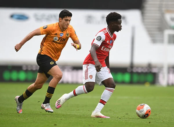 Bukayo Saka vs Raul Jimenez: Intense Battle at Molineux - Wolverhampton Wanderers vs Arsenal FC, Premier League 2019-2020