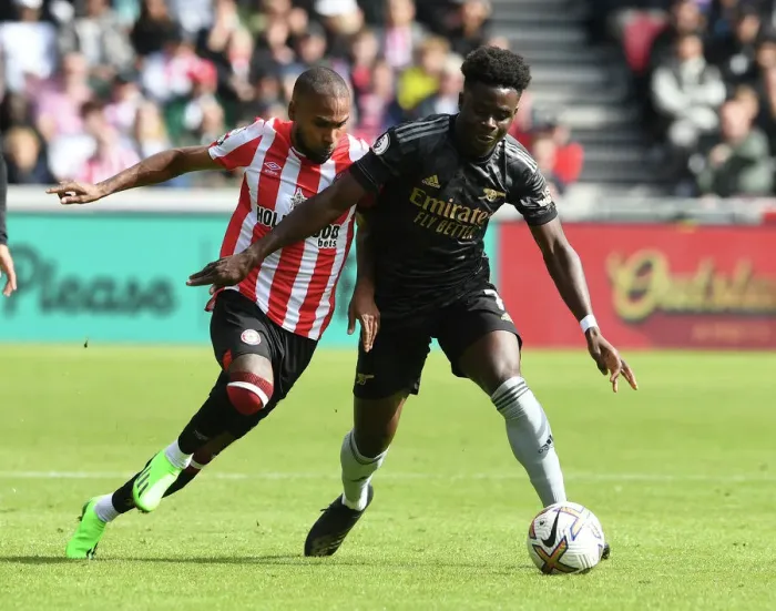 Framed Print : Bukayo Saka vs. Rico Henry: A Fierce Battle in the 2022-23 Premier League Clash between Brentford and Arsenal Framed Print : Bukayo Saka vs. Rico Henry: A Fierce Battle in the 2022-23 Premier League Clash between Brentford and Arsenal