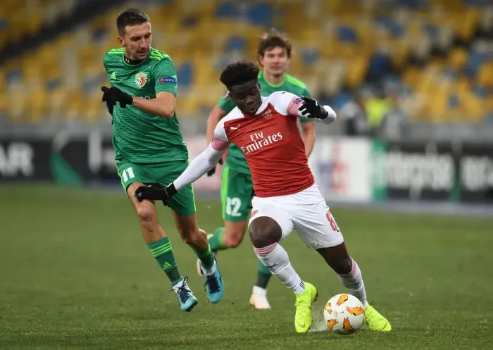 Framed Print : Bukayo Saka vs. Vyacheslav Sharpar: Arsenal's Rising Star Clashes in Europa League Showdown
