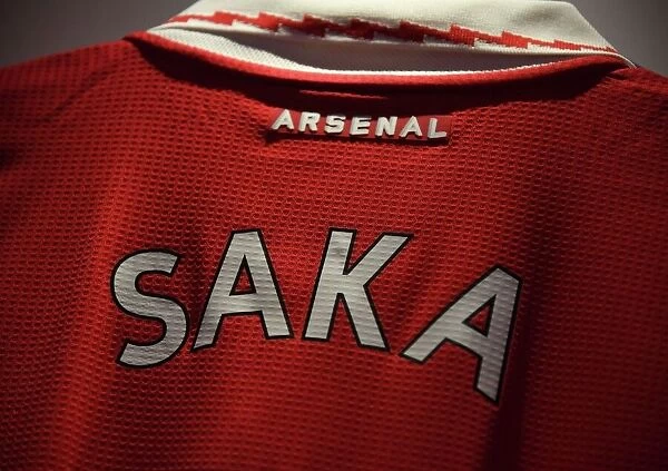 Bukayo Saka's Arsenal Jersey in the Emirates Changing Room: Preparing for Arsenal vs. Tottenham Hotspur (Premier League 2022-23)
