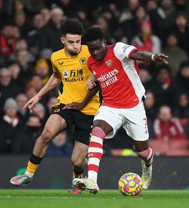 Framed Print : Bukayo Saka's Slick Moves: Outsmarting Wolves Ait-Nouri in Arsenal's Premier League Victory Framed Print : Bukayo Saka's Slick Moves: Outsmarting Wolves Ait-Nouri in Arsenal's Premier League Victory