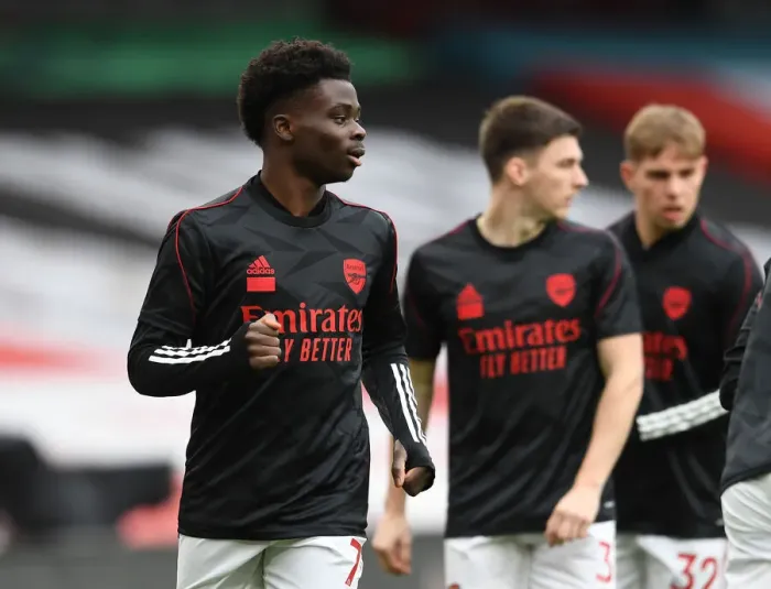 Framed Print : Bukayo Saka's Unwavering Focus: Arsenal vs. Tottenham Showdown