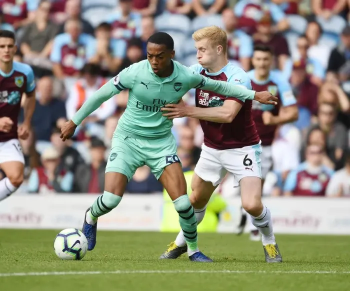 Framed Print : Burnley vs Arsenal: Joe Willock Clashes with Ben Mee in Intense Premier League Showdown