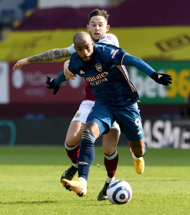 Framed Print : Burnley vs. Arsenal: Lacazette vs. Brownhill - A Head-to-Head Battle in Empty Turf Moor, Premier League (2020-21) Framed Print : Burnley vs. Arsenal: Lacazette vs. Brownhill - A Head-to-Head Battle in Empty Turf Moor, Premier League (2020-21)