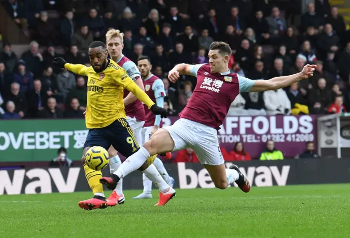 Framed Print : Burnley vs Arsenal: Lacazette vs Tarkowski Clash in Premier League Showdown
