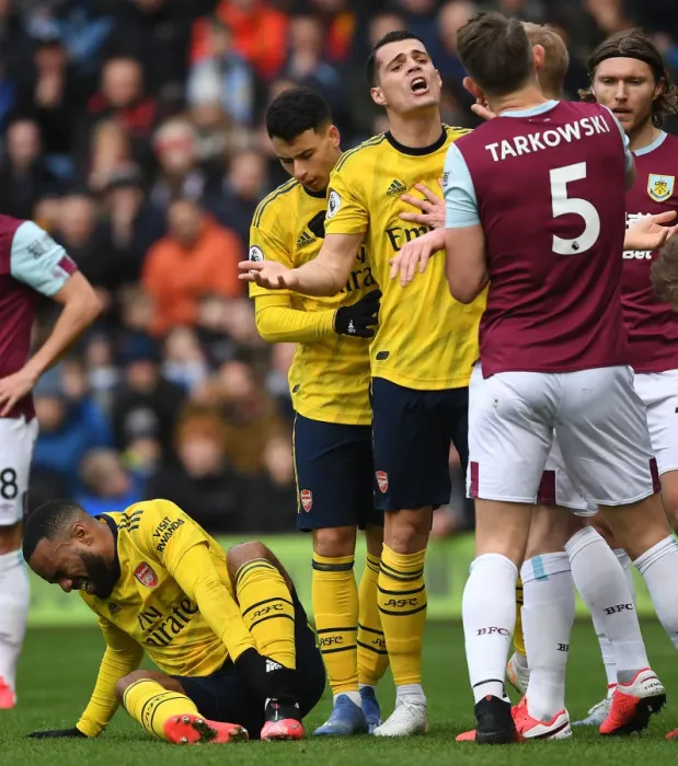 Framed Print : Burnley vs Arsenal: Xhaka and Tarkowski Clash in Intense Premier League Showdown