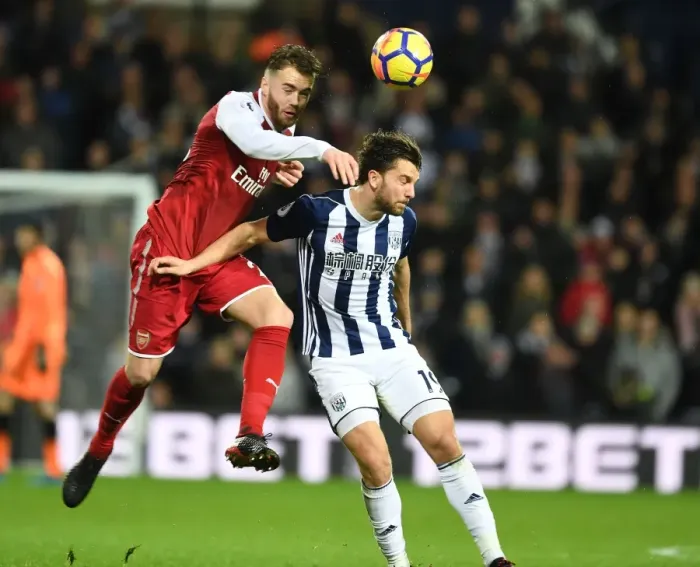 Framed Print : Calum Chambers vs Jay Rodriguez: A Tense Heading Duel in Arsenal's Premier League Battle with West Bromwich Albion (2017-18)