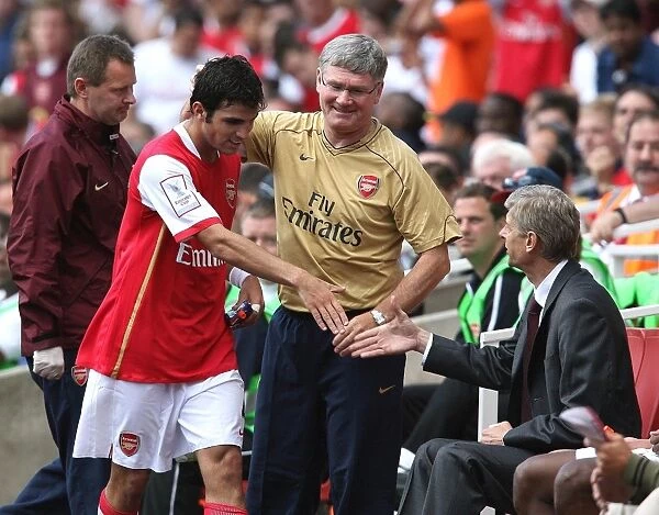 Cecs Fabregas (Arsenal) and Arsene Wenger Arsenal manager