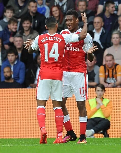 Celebrating Their First: Iwobi and Walcott's Thrilling Goal Moment at Hull City vs Arsenal (2016-17)