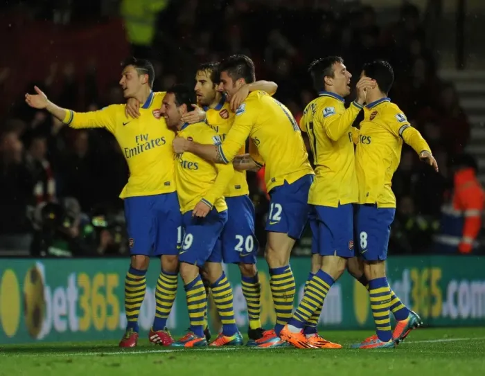 Framed Print : Celebrating Glory: Cazorla, Giroud, Ozil, and Flamini's Unforgettable Moment at Southampton (Arsenal's 2013-14 Premier League Victory)