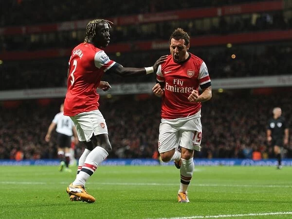 Celebrating Glory: Cazorla and Sagna's Unforgettable Goal Connection (Arsenal vs Liverpool, 2013-14)