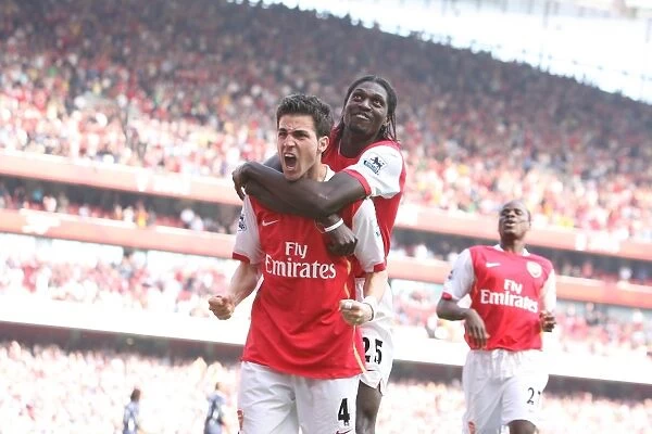 Celebrating Glory: Fabregas and Adebayor Rejoice After Arsenal's Second Goal vs. Bolton Wanderers (2007)