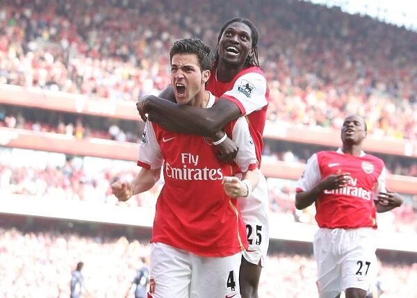 Celebrating Glory: Fabregas and Eboue Rejoice in Arsenal's 2-1 Victory