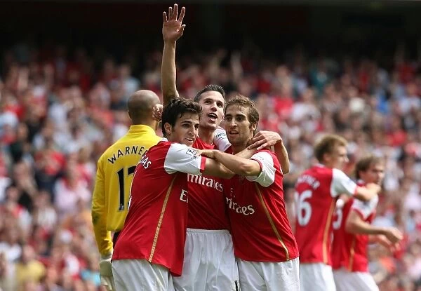 Celebrating the Goal: Van Persie, Fabregas, and Flamini Rejoice as Hleb Scores for Arsenal Against Fulham (2007)