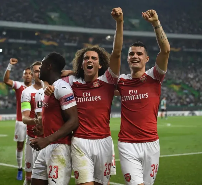 Framed Print : Celebrating a Goal: Welbeck, Guendouzi, and Xhaka (Sporting Lisbon vs Arsenal, 2018-19)