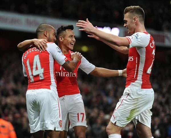 Celebrating Their Success: Sanchez, Walcott, and Chambers Unforgettable Moment at Arsenal vs. Burnley (2014 / 15)